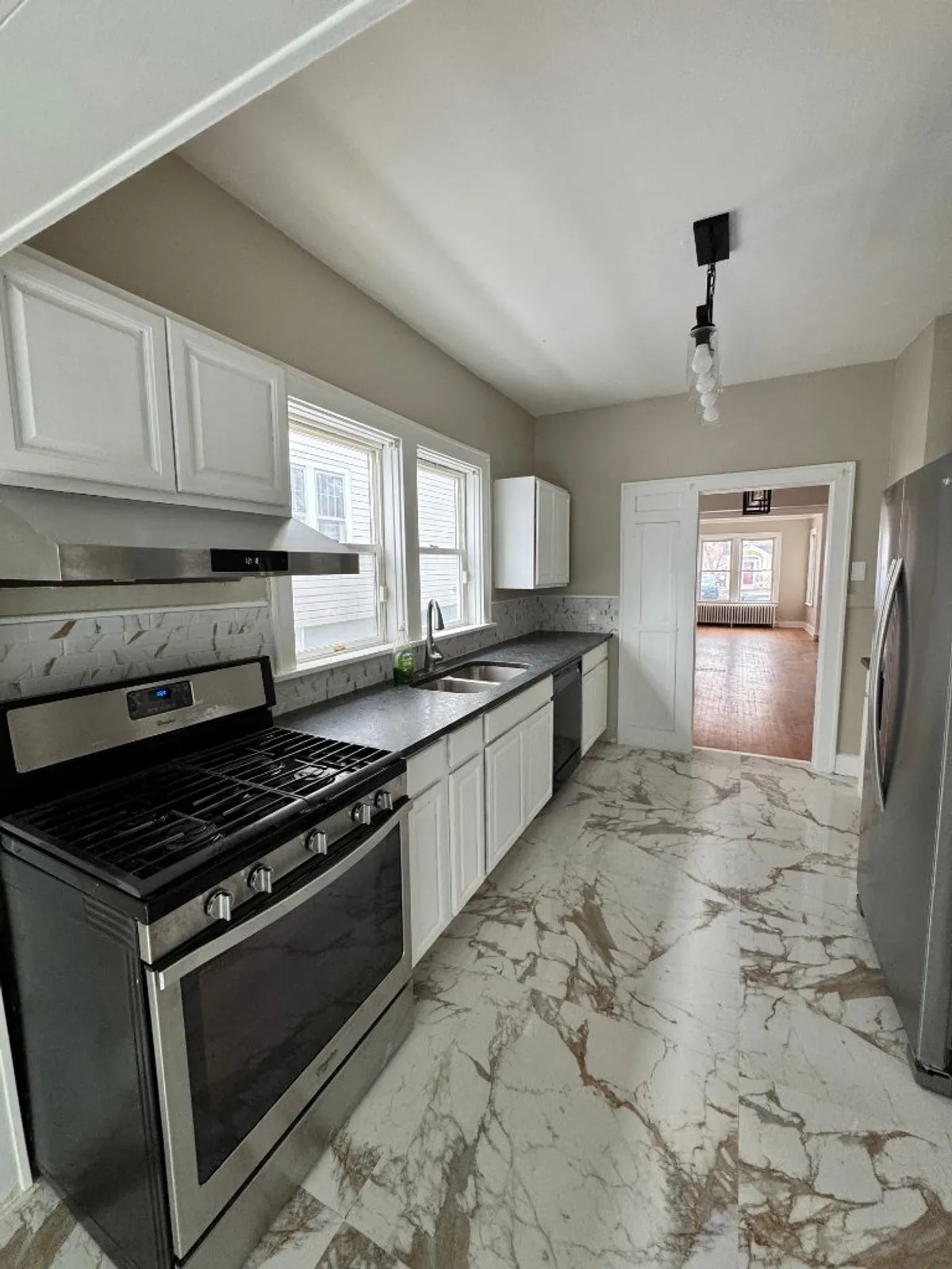 Kitchen after renovation with marble floors — Albany NY by Capital Handy Manny